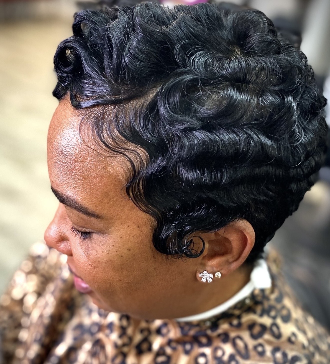 Black sculpted wave hairstyle by Genetik Bleu Salon