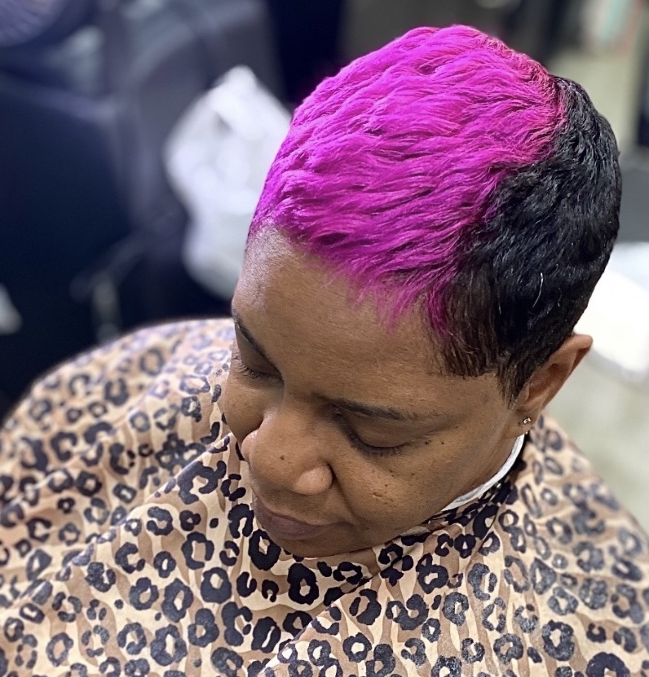 Magenta and black short hairstyle by Genetik Bleu Salon