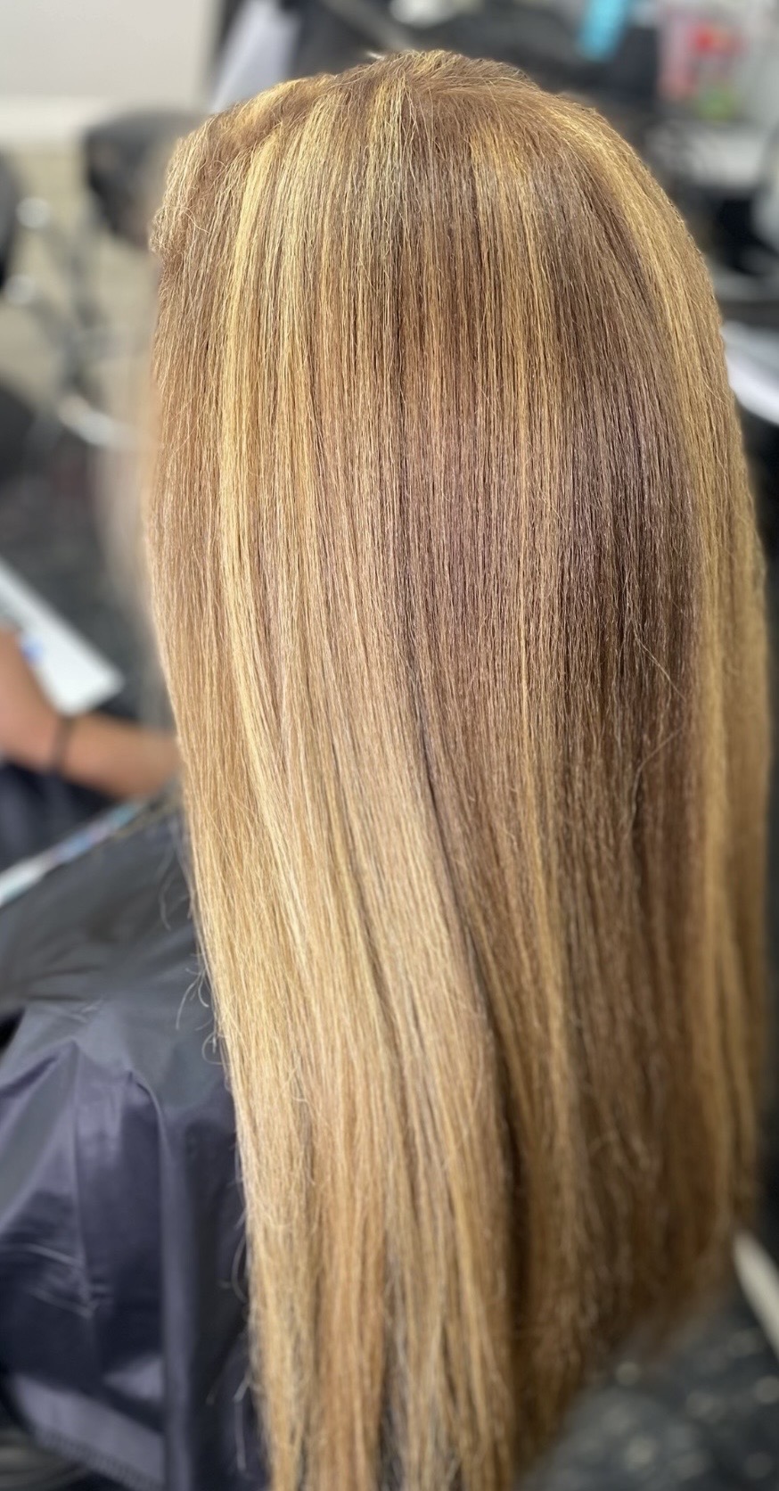 Long smooth blonde highlighted hairstyle by Marni
