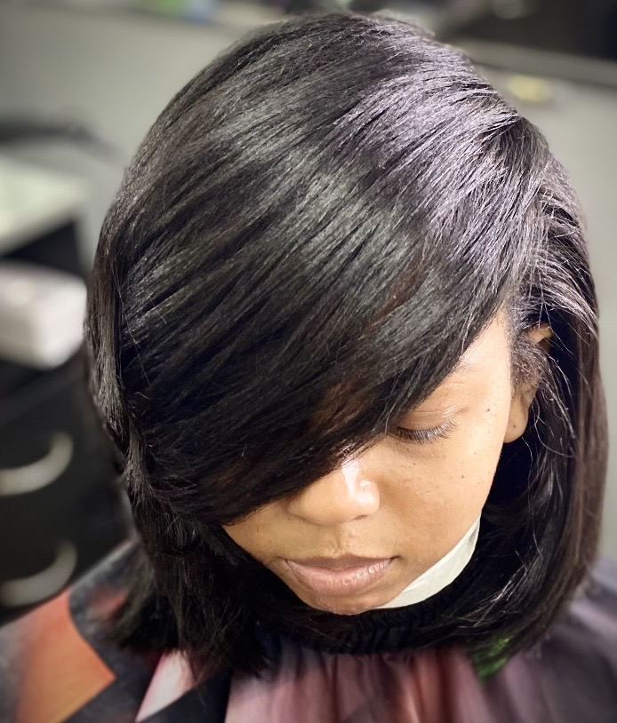 Smooth black silk press and bob finish at Genetik Bleu Salon